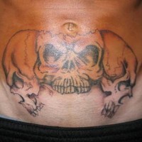 Stomach tattoo, three,black and white, teethy skulls