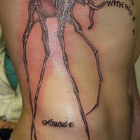 Surreal dali elephant skeleton tattoo