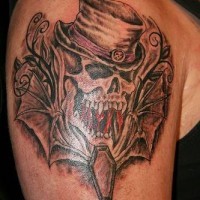 Skull in cylinder with winged coffin tattoo