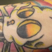 Cartoonish skull coloured tattoo