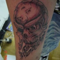 Evil crushed skull tattoo