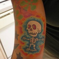 Cartoonish skeleton coloured tattoo