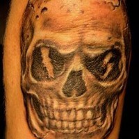 Human skull with lightning tattoo