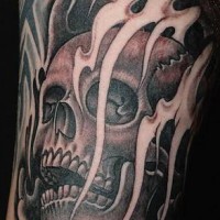 Skull in black smoke tattoo