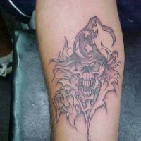 Skull in wizard cap tattoo