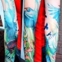 Bird themed sleeve tattoo