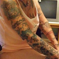 Cherub themed full sleeve tattoo