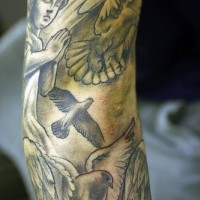 Praying cherubs and doves seeve tattoo