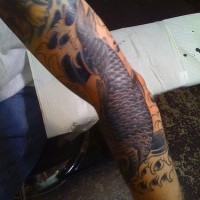 Koi themed sleeve tattoo