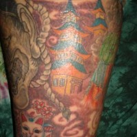 Asian pagoda and demons sleeve tattoo