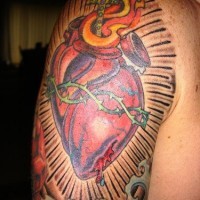 Detailed sacred heart tattoo on sleeve