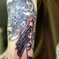 Skulls and guns sleeve tattoo