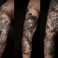 Black lotus themed sleeve tattoo