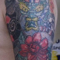 Magic dragon and flowers sleeve tattoo