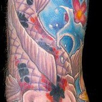 Colourful koi themed sleeve tattoo