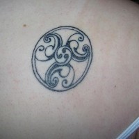 Circle black tracery tattoo