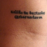 Small black writings tattoo