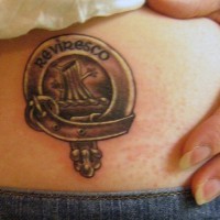Small family crest black ink tattoo