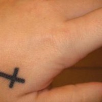 Small latin cross tattoo