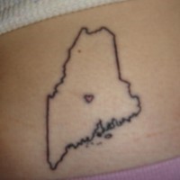Small map lower back tattoo