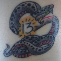 Purple snake with thirteen number tattoo