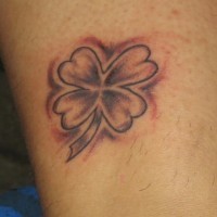 Black ink four leaf clover tattoo