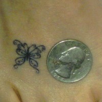 Tiny butterfly tracery tattoo