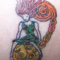 Colourful red haired girl on planet tattoo