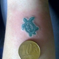 Tiny green turtle tattoo