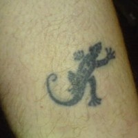 Small black ink lizard tattoo
