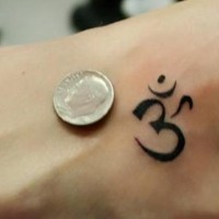 Small aum symbol tattoo