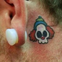 Clown skull tattoo behind ear