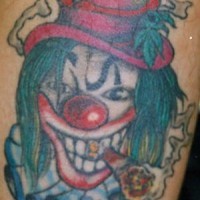 Clown smoking joints tattoo