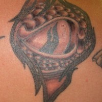 Snake eye black ink tattoo