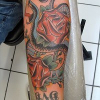 Snake and red roses tattoo