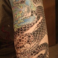Asian style black snake tattoo
