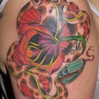 Snake abd flower coloured shoulder tattoo