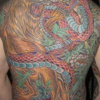 Full back snake and lion tattoo