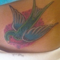 Flying, colourful, beautiful sparrow hip tattoo
