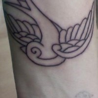 Tatuaggio non colorato sul polso l'uccello