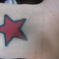 Red star tattoo on leg