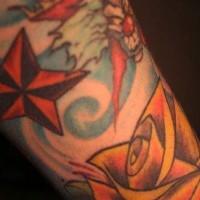 Star and evil clown  tattoo