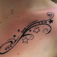 Star shoulder tattoo, black pattern with curls