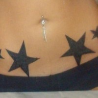 Stomach tattoo, black,big and little clear stars