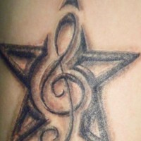Star and treble clef tattoo