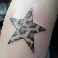 Star with leopard texture tattoo