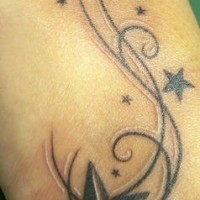Star tracery tattoo on foot