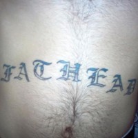Stomach tattoo, designed letters, wide inscription