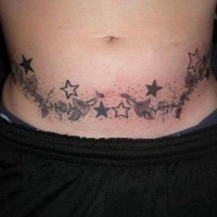Stomach tattoo, plant with many leaves and stars
