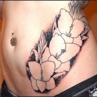 Stomach tattoo, pant with three white flowers